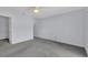 Spacious bedroom with grey carpet, ceiling fan and a large closet at 218 Balfour Dr # 12, Winter Park, FL 32792