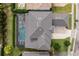 Aerial view of house, pool, and surrounding landscape at 2205 Lake Sylvan Oaks Ct, Sanford, FL 32771