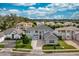 Luxury home community, featuring a stunning two-story house with a stone facade and tile roof at 2205 Lake Sylvan Oaks Ct, Sanford, FL 32771