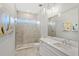 Elegant bathroom with a walk-in shower and modern vanity at 2205 Lake Sylvan Oaks Ct, Sanford, FL 32771