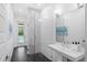 Modern bathroom with a frameless shower and stylish chevron tile at 2205 Lake Sylvan Oaks Ct, Sanford, FL 32771