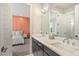 Modern bathroom with double vanity and view of bedroom at 2205 Lake Sylvan Oaks Ct, Sanford, FL 32771