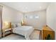 Bright bedroom with a king-size bed and wood dresser at 2205 Lake Sylvan Oaks Ct, Sanford, FL 32771