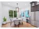 Charming breakfast nook with a round table and chairs, near the kitchen at 2205 Lake Sylvan Oaks Ct, Sanford, FL 32771