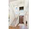 Bright and airy two story entry with modern staircase and wood floors at 2205 Lake Sylvan Oaks Ct, Sanford, FL 32771