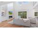 Elegant living room featuring hardwood floors, fireplace, and pool access at 2205 Lake Sylvan Oaks Ct, Sanford, FL 32771