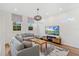Spacious loft with hardwood floors, a large TV, and comfortable seating area at 2205 Lake Sylvan Oaks Ct, Sanford, FL 32771