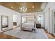 Spacious Primary bedroom with hardwood floors, large windows and ensuite bathroom at 2205 Lake Sylvan Oaks Ct, Sanford, FL 32771