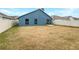 Large backyard with grassy lawn and privacy fence at 225 Arbuthnot St, Winter Haven, FL 33881