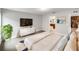 Bright bedroom with large bed, dresser, and ensuite bathroom access at 225 Arbuthnot St, Winter Haven, FL 33881