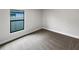 Cozy bedroom with carpet and a window overlooking backyard at 225 Arbuthnot St, Winter Haven, FL 33881