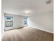Well-lit bedroom with plush carpeting and two windows at 225 Arbuthnot St, Winter Haven, FL 33881
