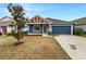 Charming curb appeal with a two car garage and manicured lawn at 225 Arbuthnot St, Winter Haven, FL 33881