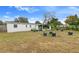 Large backyard with a screened patio and potted plants at 2336 Nansen Ave, Orlando, FL 32817