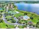 Community pool, tennis courts, and playground near a lake at 2806 Balforn Tower Way, Winter Garden, FL 34787