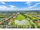 Aerial view of community with lake, golf course, and homes at 2806 Balforn Tower Way, Winter Garden, FL 34787