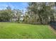 Landscaped backyard with a fenced perimeter at 2806 Balforn Tower Way, Winter Garden, FL 34787