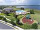 Aerial view of community pool, playground, and lake at 2806 Balforn Tower Way, Winter Garden, FL 34787