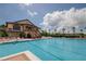 Resort-style pool with clubhouse and ample seating at 2806 Balforn Tower Way, Winter Garden, FL 34787