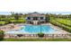 Community pool with spacious deck and clubhouse at 2806 Balforn Tower Way, Winter Garden, FL 34787