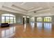 Large community room with hardwood floors and lake views at 2806 Balforn Tower Way, Winter Garden, FL 34787