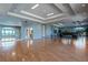 Bright community room with hardwood floors and mirrors at 2806 Balforn Tower Way, Winter Garden, FL 34787
