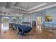 Spacious community room with tables, chairs, and a podium at 2806 Balforn Tower Way, Winter Garden, FL 34787