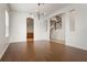 Open concept dining room with hardwood floors and kitchen views at 2806 Balforn Tower Way, Winter Garden, FL 34787