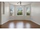 Bright dining room with hardwood floors and large windows at 2806 Balforn Tower Way, Winter Garden, FL 34787