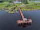 Community wooden dock with gazebo on the lake at 2806 Balforn Tower Way, Winter Garden, FL 34787