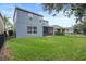 Two-story house with a screened patio and grassy yard at 2806 Balforn Tower Way, Winter Garden, FL 34787