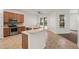 Kitchen with stainless steel appliances and a large island at 2806 Balforn Tower Way, Winter Garden, FL 34787