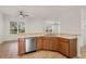 Kitchen with island, stainless steel appliances, and wood cabinets at 2806 Balforn Tower Way, Winter Garden, FL 34787