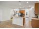 Kitchen with island, wood cabinets, and stainless steel appliances at 2806 Balforn Tower Way, Winter Garden, FL 34787