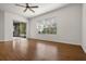 Living area with hardwood floors, sliding glass doors, and ceiling fan at 2806 Balforn Tower Way, Winter Garden, FL 34787