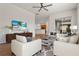 Spacious living room with hardwood floors and access to a patio at 2806 Balforn Tower Way, Winter Garden, FL 34787