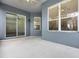 Covered patio with sliding glass doors at 2806 Balforn Tower Way, Winter Garden, FL 34787