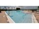 Community pool with ample deck space and lounge chairs at 2806 Balforn Tower Way, Winter Garden, FL 34787