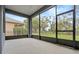 Spacious screened patio with backyard access at 2806 Balforn Tower Way, Winter Garden, FL 34787