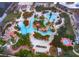 Large community pool complex with multiple pools and a waterslide at 3030 Calabria Ave # 436, Davenport, FL 33897