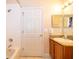 Clean bathroom with granite vanity and a bathtub at 3030 Calabria Ave # 436, Davenport, FL 33897