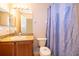 Well-lit bathroom with granite vanity and shower at 3030 Calabria Ave # 436, Davenport, FL 33897