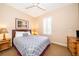Spacious bedroom with a comfortable bed and ample natural light at 3030 Calabria Ave # 436, Davenport, FL 33897