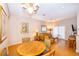 Small dining area with wood table and chairs, near living room at 3030 Calabria Ave # 436, Davenport, FL 33897