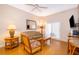 Living room with wicker furniture and sliding door to patio at 3030 Calabria Ave # 436, Davenport, FL 33897