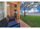 Relaxing patio with seating area, overlooking grassy backyard at 3030 Calabria Ave # 436, Davenport, FL 33897