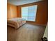 Spacious bedroom with large window and neutral carpeting at 4136 Versailles Dr # 4136D, Orlando, FL 32808