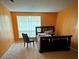 Spacious bedroom with a sleigh bed and window at 4136 Versailles Dr # 4136D, Orlando, FL 32808