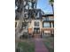 Attractive condo building exterior with landscaping and walkway at 4136 Versailles Dr # 4136D, Orlando, FL 32808
