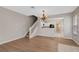 Bright dining area with hardwood floors and a view of the kitchen and living room at 6292 Twain St # 101, Orlando, FL 32835
